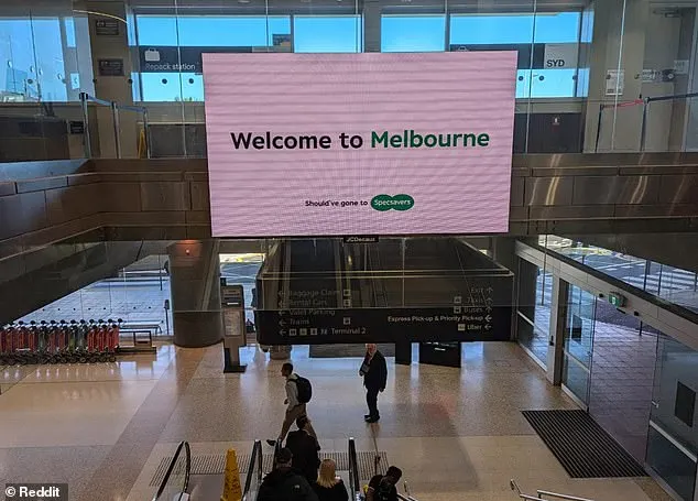 A photograph of the billboard in Sydney airport saying 'welcome to Melbourne'